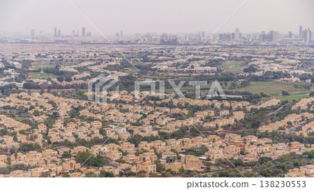 Aerial view of apartment houses and villas in Dubai city timelapse, United Arab Emirates Aerial view of apartment houses and villas in Dubai city timelapse, United Arab Emirates 138230553