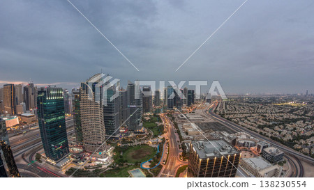Jumeirah Lake Towers residential district aerial day to night timelapse near Dubai Marina 138230554
