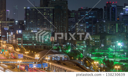 Dubai Golf Course with a cityscape of Greens and tecom districts at the background aerial night timelapse Dubai Golf Course with a cityscape of Greens and tecom districts at the background aerial night timelapse 138230639