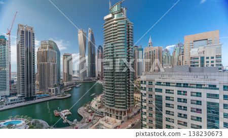 Aerial view of Dubai Marina residential and office skyscrapers with waterfront timelapse 138230673