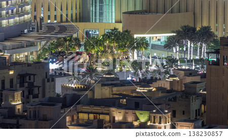 Top view of shopping mall entrance and parking area timelapse with traffic on the road. 138230857