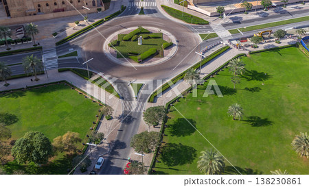 Aerial view of a roundabout circle road in Dubai downtown from above timelapse. Dubai, United Arab Emirates. Aerial view of a roundabout circle road in Dubai downtown from above timelapse. Dubai, United Arab Emirates. 138230861