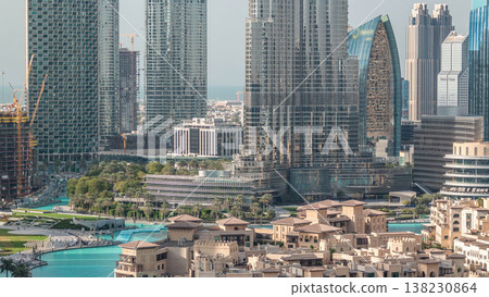 Famous musical fountain in Dubai with skyscrapers in the background aerial timelapse 138230864
