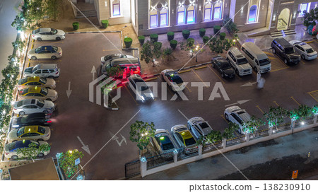 Cars moving on parking near Al Rahim Mosque in Dubai Marina aerial timelapse Cars moving on parking near Al Rahim Mosque in Dubai Marina aerial timelapse 138230910