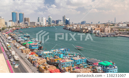 Loading a ship in port timelapse in Dubai, Deira creek, UAE. Loading a ship in port timelapse in Dubai, Deira creek, UAE. 138231007