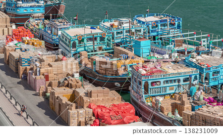 Loading a ship in port timelapse in Dubai, Deira creek, UAE. Loading a ship in port timelapse in Dubai, Deira creek, UAE. 138231009