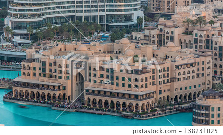 Dubai downtown with fountains area near mall and souk timelapse. Dubai downtown with fountains area near mall and souk timelapse. 138231025