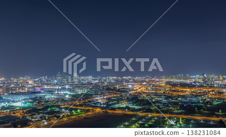 The rhythm of the city at night with illuminated road in Dubai near canal aerial timelapse The rhythm of the city at night with illuminated road in Dubai near canal aerial timelapse 138231084