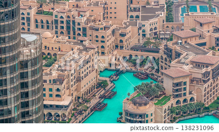 Dubai downtown with fountains area near mall and souk timelapse. Dubai downtown with fountains area near mall and souk timelapse. 138231096
