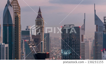 Dubai International Financial Centre district with modern skyscrapers night to day timelapse Dubai International Financial Centre district with modern skyscrapers night to day timelapse 138231155