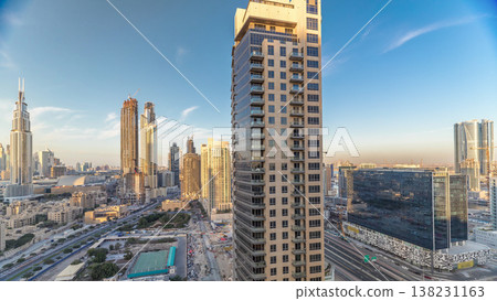 Beautiful skyline of Dubai downtown and Business bay with modern architecture during sunset. 138231163