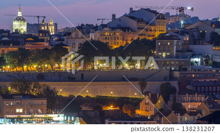 Lisbon panorama after sunset aerial view of city centre with red roofs at autumn day to night timelapse, Portugal Lisbon panorama after sunset aerial view of city centre with red roofs at autumn day to night timelapse, Portugal 138231207