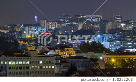 Lisbon aerial view of city centre with illuminated building at night timelapse, Portugal 138231208