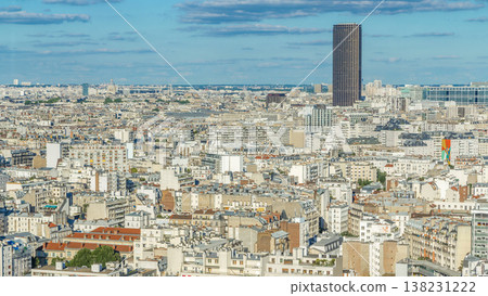 Aerial panorama above many houses rooftops in a Paris timelapse 138231222