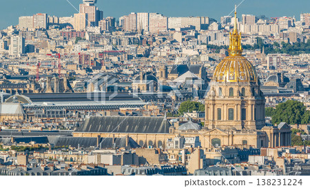Aerial panorama above many houses rooftops in a Paris timelapse 138231224