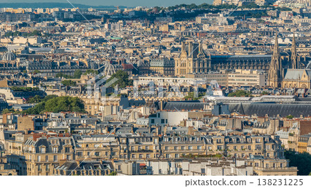 Aerial panorama above many houses rooftops in a Paris timelapse Aerial panorama above many houses rooftops in a Paris timelapse 138231225