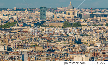 Aerial panorama above many houses rooftops in a Paris timelapse Aerial panorama above many houses rooftops in a Paris timelapse 138231227