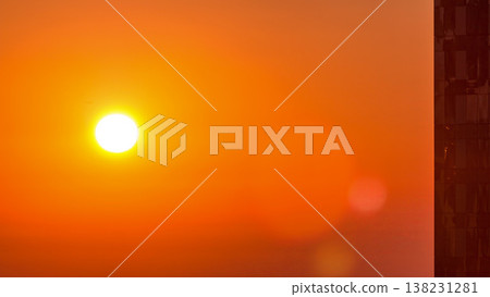Sunrise close up view over Dubai skyline in the morning, aerial top view from downtown timelapse. 138231281