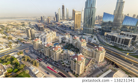 Dubai downtown skyline at sunset timelapse and road traffic near mall, UAE Dubai downtown skyline at sunset timelapse and road traffic near mall, UAE 138231341