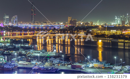 Dubai creek landscape night timelapse with boats and ship near waterfront Dubai creek landscape night timelapse with boats and ship near waterfront 138231379