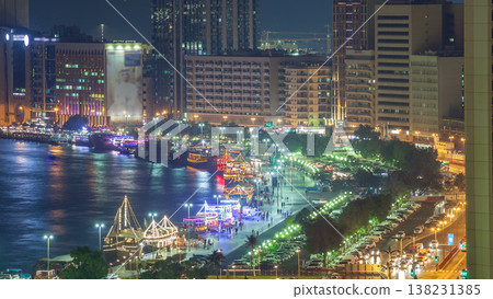 Dubai creek landscape night timelapse with boats and ship near waterfront Dubai creek landscape night timelapse with boats and ship near waterfront 138231385