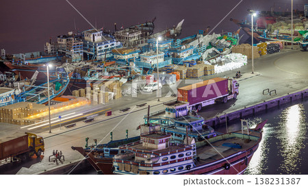 Loading a ship in Port Said night timelapse in Dubai, UAE. Loading a ship in Port Said night timelapse in Dubai, UAE. 138231387