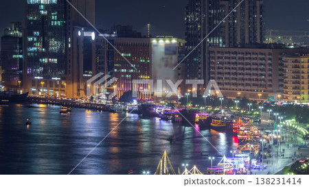 Dubai creek landscape night timelapse with boats and ship near waterfront Dubai creek landscape night timelapse with boats and ship near waterfront 138231414