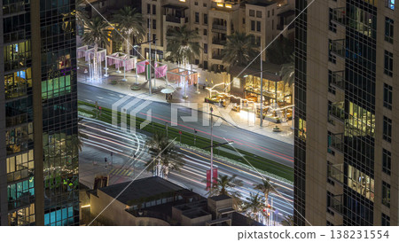 Birds eye view of Dubai skyline timelapse and rush hour traffic in downtown at night Birds eye view of Dubai skyline timelapse and rush hour traffic in downtown at night 138231554