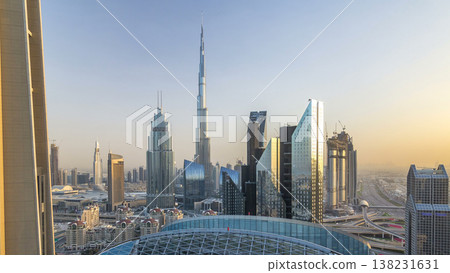 Dubai downtown skyline at sunset timelapse with tallest building and Sheikh Zayed road traffic, UAE Dubai downtown skyline at sunset timelapse with tallest building and Sheikh Zayed road traffic, UAE 138231631