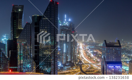Dubai downtown skyline night timelapse and Sheikh Zayed road traffic, UAE Dubai downtown skyline night timelapse and Sheikh Zayed road traffic, UAE 138231638