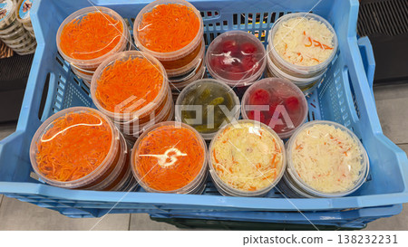 Close-up of sauerkraut, pickled carrots and pickles on display in a grocery store 138232231