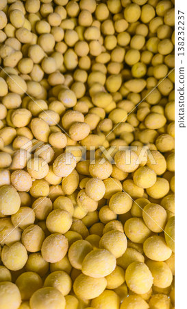 Roasted peanuts in salted glaze on display in a store, snack and appetizer Roasted peanuts in salted glaze on display in a store, snack and appetizer 138232237