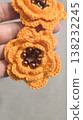 Crochet orange flowers with beads on a gray background. Design example. 138232245