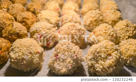 Sushi balls made of breaded rice and filling, baked in the oven, homemade food Sushi balls made of breaded rice and filling, baked in the oven, homemade food 138232246