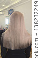 Blonde hair. Hair coloring and drying process at a beauty salon. Medium length. 138232249