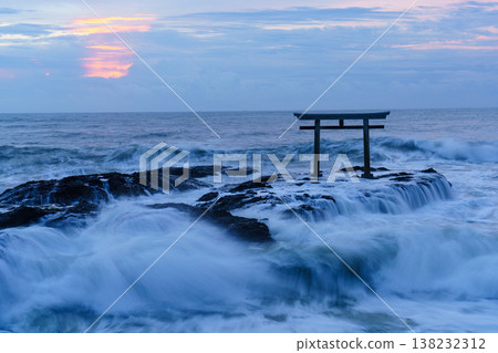 The torii gate of Kamiiso stands amidst rough waves, creating a fantastical seascape. Oarai Isomae Shrine, Ibaraki Prefecture. 138232312