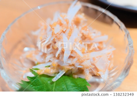 A small bowl dish topped with plum crystal 138232349