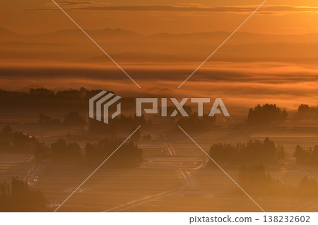 Farm village wrapped in fog Farm village wrapped in fog 138232602
