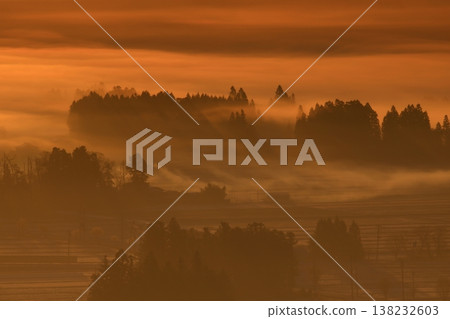 Farm village wrapped in fog Farm village wrapped in fog 138232603