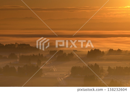 Farm village wrapped in fog Farm village wrapped in fog 138232604