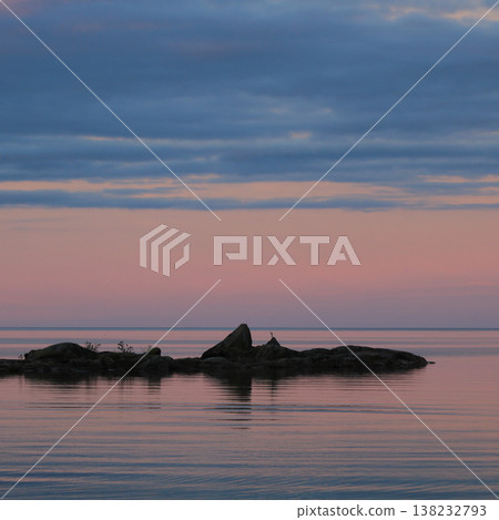 Pink evening sky over Lake Vanern, dreamlike sunset scene, Vita Sannar, Sweden. Pink evening sky over Lake Vanern, dreamlike sunset scene, Vita Sannar, Sweden. 138232793