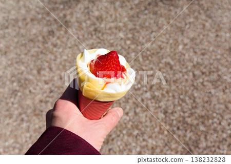 Strawberry crepe, a sweet treat to eat while walking around. 138232828