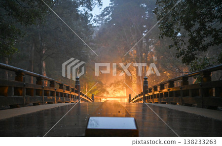 A fantastical scene of light and a bridge floating in a misty forest. A fantastical scene of light and a bridge floating in a misty forest. 138233263