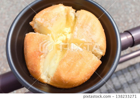 A cross-section of a potato with melted butter, a Hokkaido gourmet ingredient perfect for eating on the go. A cross-section of a potato with melted butter, a Hokkaido gourmet ingredient perfect for eating on the go. 138233271