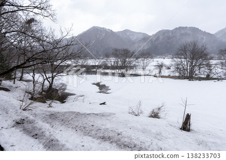 A winter landscape of Minami-Aizu in the snow, with vast snowfields and snow-covered mountain ranges stretching out before you in the countryside. A winter landscape of Minami-Aizu in the snow, with vast snowfields and snow-covered mountain ranges stretching out before you in the countryside. 138233703