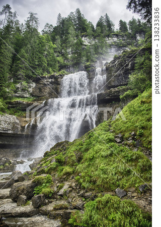 Water cascading down Vallesinella Falls in the Dolomites, Italy 138233836