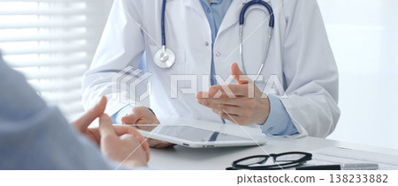 Female doctor explaining diagnosis to her patient during a medical consultation in a bright medical office, healthcare and medical concept. Medicine and health care concept Female doctor explaining diagnosis to her patient during a medical consultation in a bright medical office, healthcare and medical concept. Medicine and health care concept 138233882