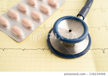 Stethoscope on electrocardiogram ECG with drug, heart wave, heart attack, cardiogram report. Stethoscope on electrocardiogram ECG with drug, heart wave, heart attack, cardiogram report. 138234498
