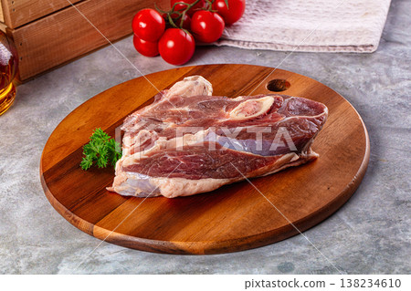 Raw lamb steak with bone 138234610