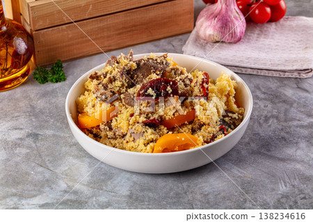 Traditional couscous with lamb and vegetables Traditional couscous with lamb and vegetables 138234616
